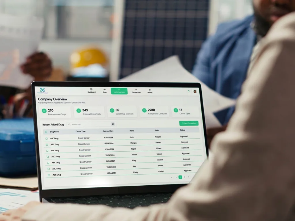 TrialTriage clinical data dashboard on a laptop